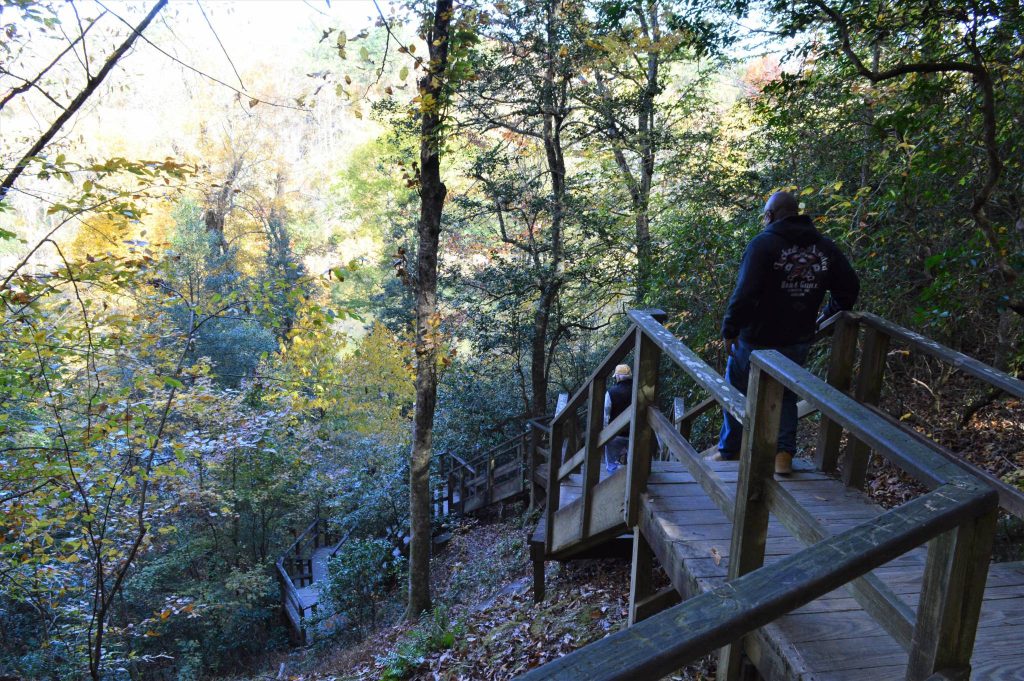 hikers descend staircase at Raven Rock State Park