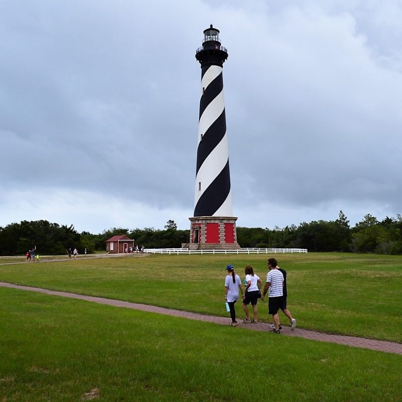 Cape Hatteras Lighthouse seen across grounds at the light station site on Cape Hatteras National Seashore, North Carolina