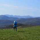 Woman on grassy bald at Max Patch in the Pisgah National Forest in North Carolina