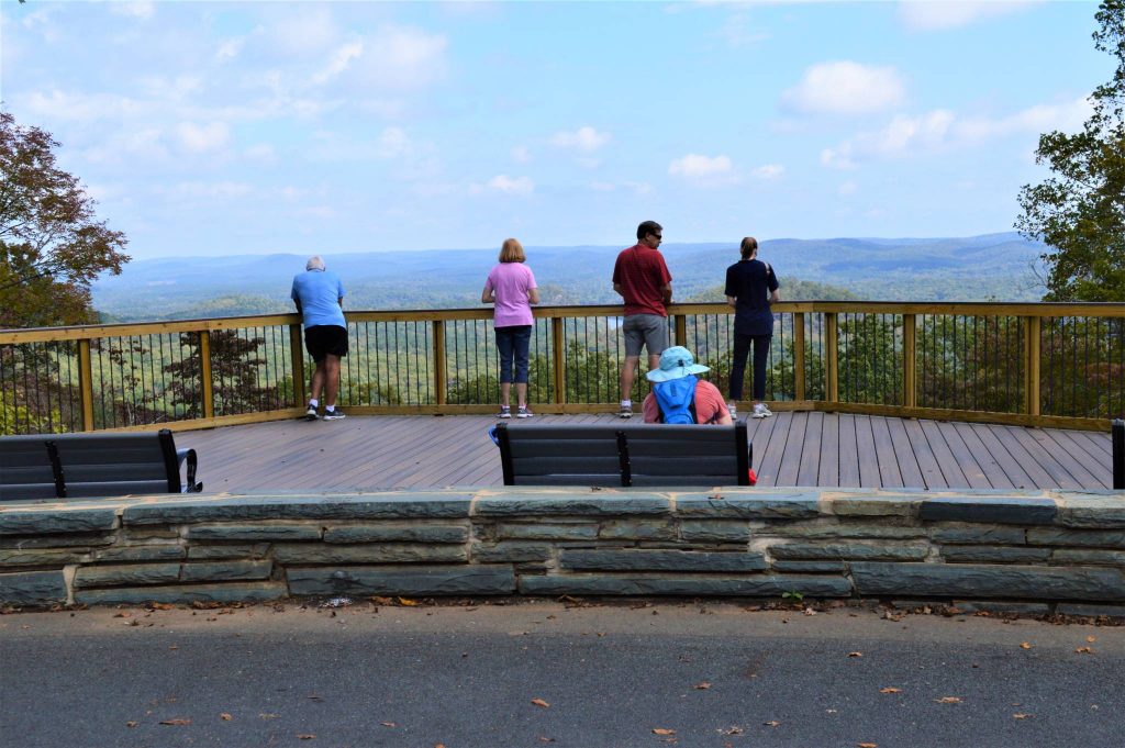 Depict people on observation deck at Morrow Mountain State Park